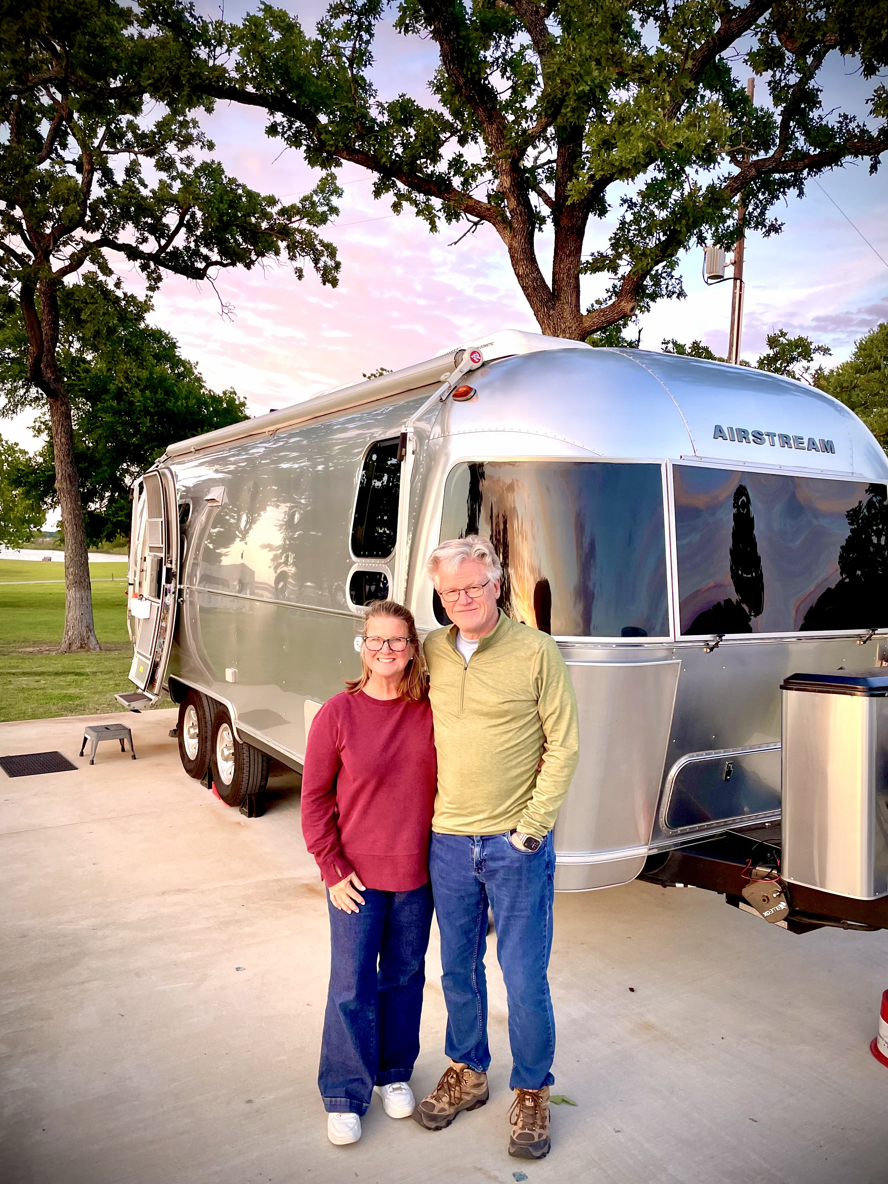 Tom and Sandra in front of Belle at the Vineyards Campground