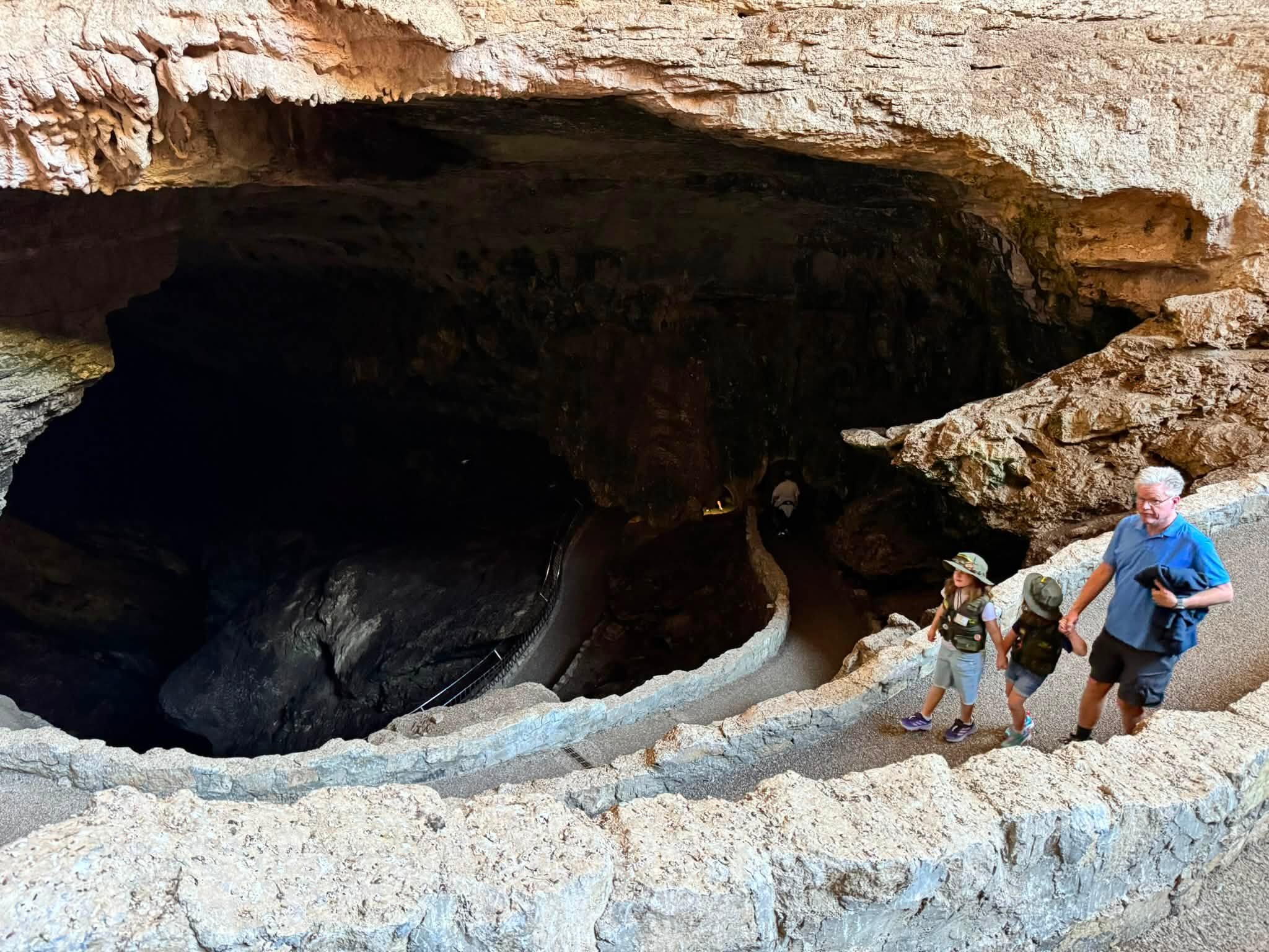 Tom and the girls walking the switchback trail down into the Natural Entrance of Carlsbad Caverns