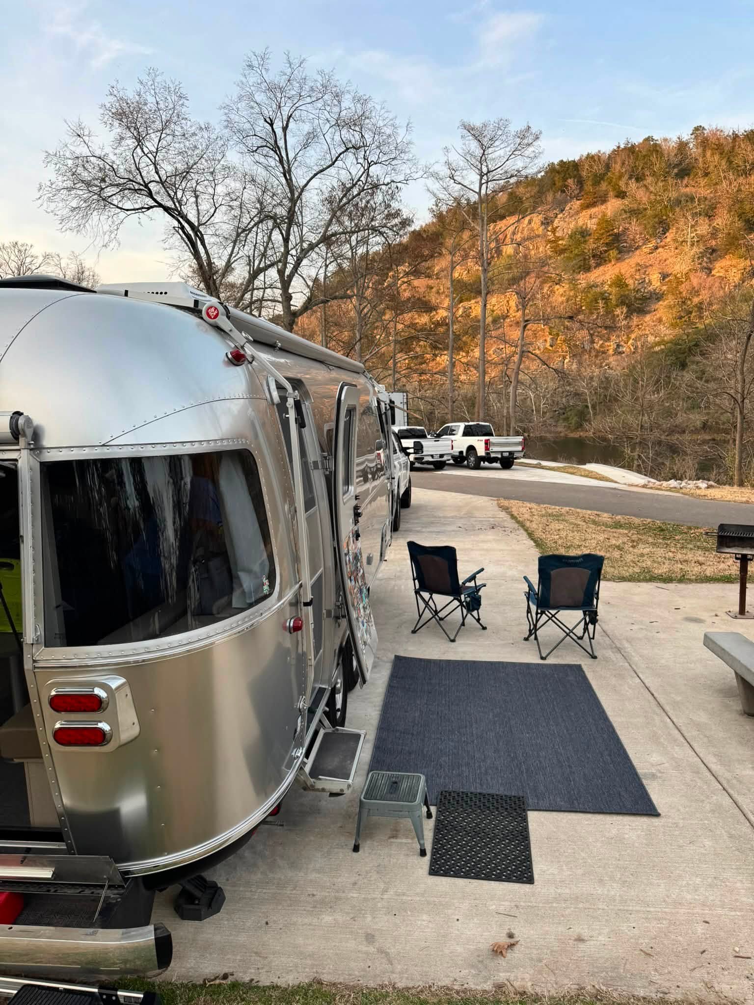 Belle parked on a campsite at Beavers Bend State Park, Oklahoma, with the bluff catching the last light