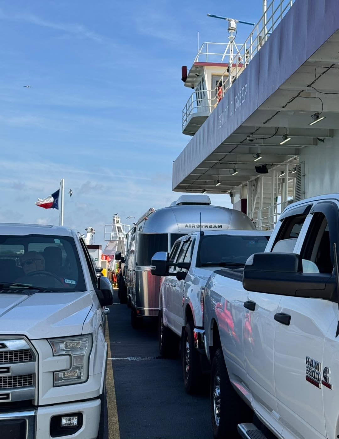 Belle in line with trucks and trailers aboard the Galveston–Bolivar ferry on the way to Crystal Beach